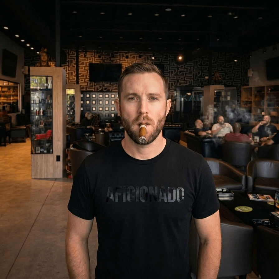 Black T-Shirt with Black Aficionado Logo on White Male Smoking a cigar in Aficionados Lounge