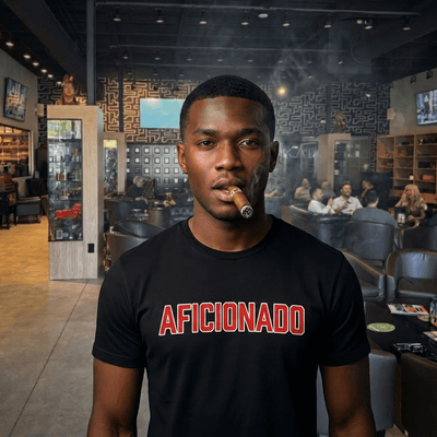 Black T-Shirt with Red Aficionado Logo on Black Male Smoking a Cigar in Aficionados Lounge
