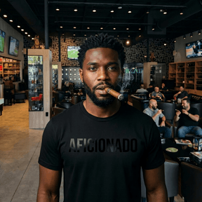 Black T-Shirt with Black Aficionado Logo on Black Male Smoking a cigar in Aficionados Lounge