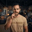 Sand T-Shirt with Sand Aficionado Logo on White Male Smoking a Cigar in Aficionados Lounge